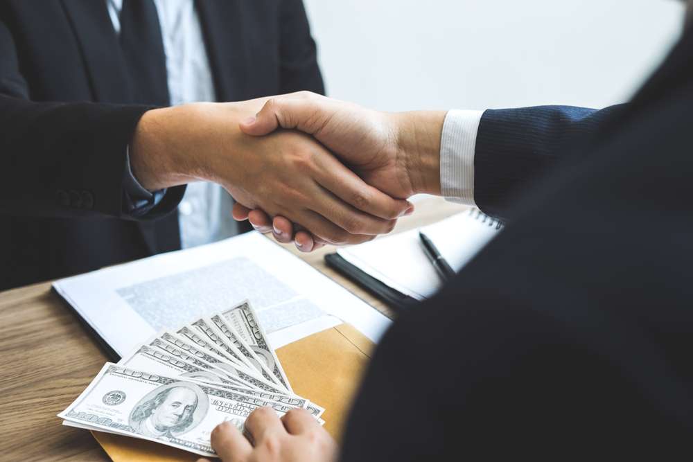 Dishonest,Cheating,In,Business,Illegal,Money,,Businessman,Handshake,Money,Of