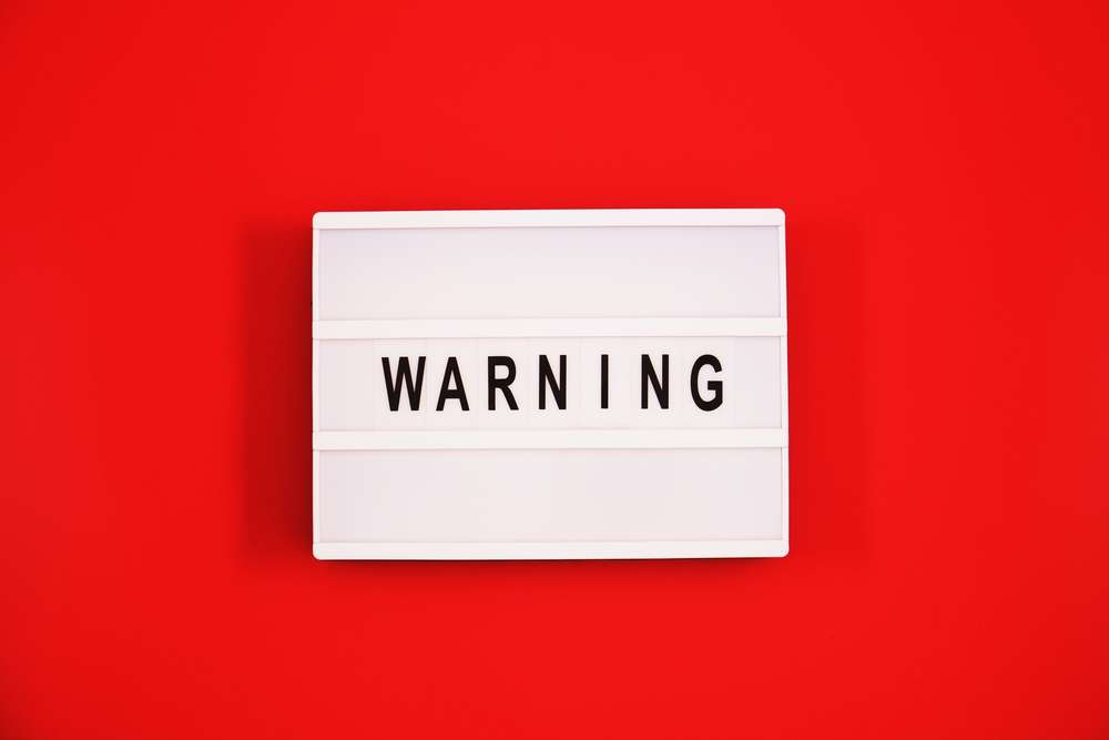Warning,Text,In,Black,And,White,On,Light,Box,Message TFSA Tax Rules Warning
